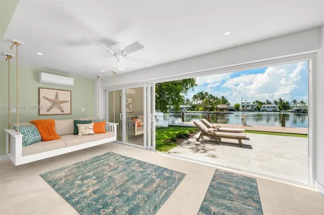 a roof deck with table and chairs