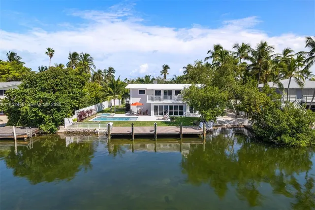 swimming pool view with a seating space
