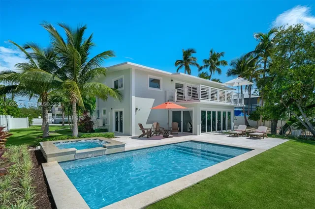 a picture of a bathroom with a sink and mirror