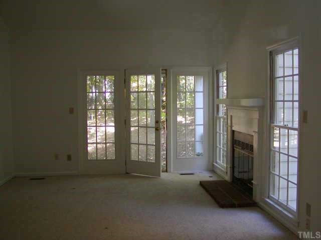1109 Esher Court Raleigh, NC 27609 - Photo 5 of 8 LARGE LIVING ROOM OR FAMILY ROOM WITH FIREPLACE AND CATHEDRAL CEILINGS Other