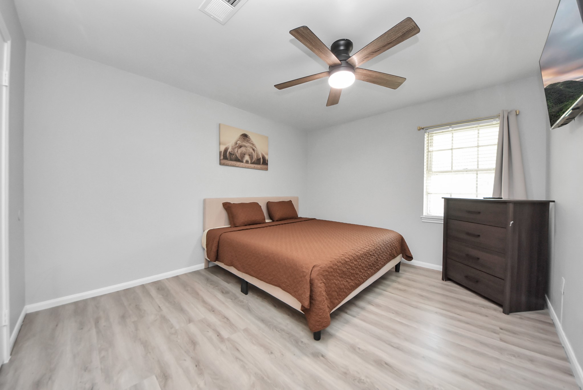 1011 Whitestone Lane Houston, TX 77073 - Photo 9 of 48 a bedroom with a bed and window