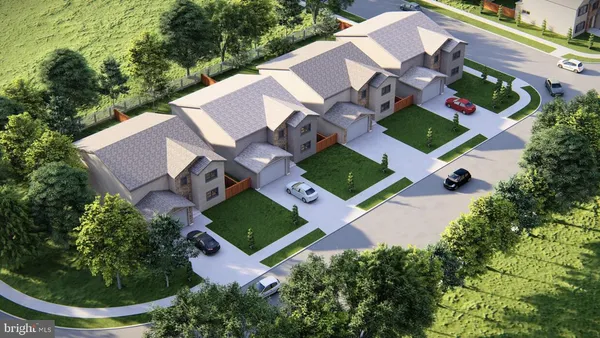 an aerial view of a house with garden space and street view