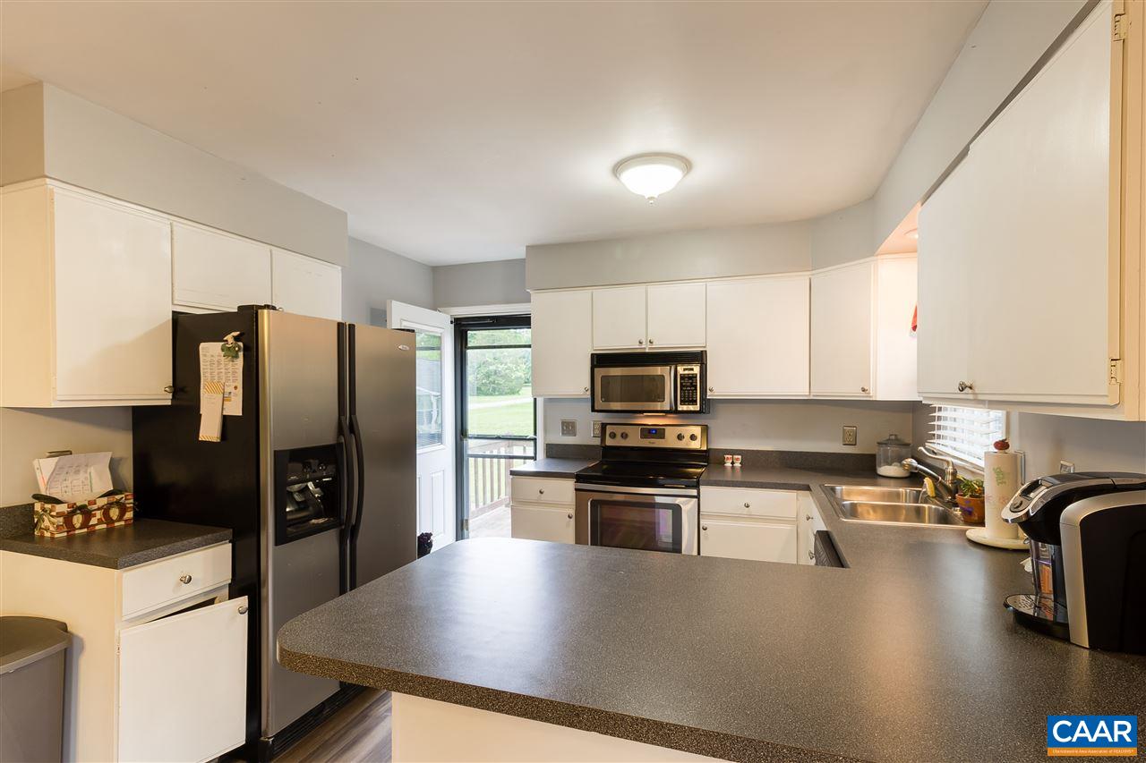 120 Narcissus Road Ruckersville, VA 22968 - Photo 8 of 23 a kitchen with kitchen island a refrigerator stove and sink