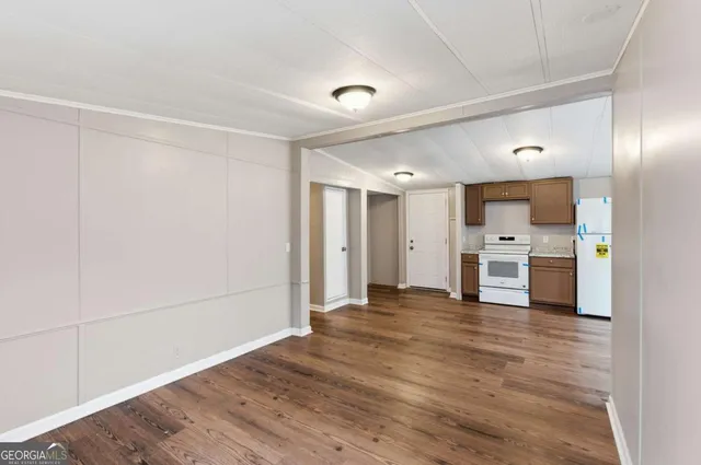 a view of a kitchen with wooden floor