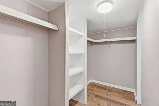 a view of an empty walk in closet
