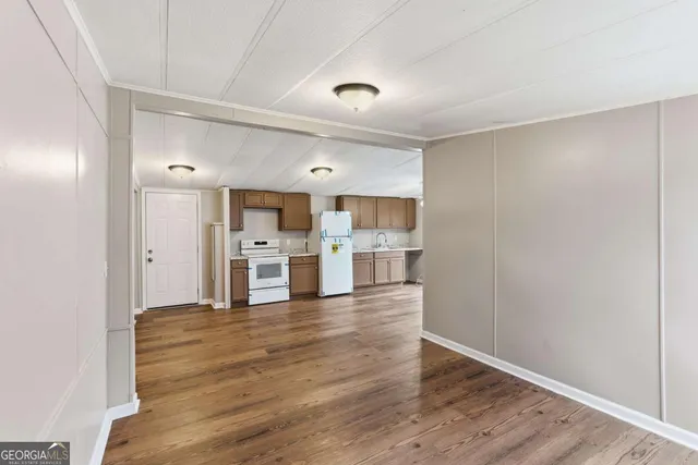a view of kitchen with wooden floor