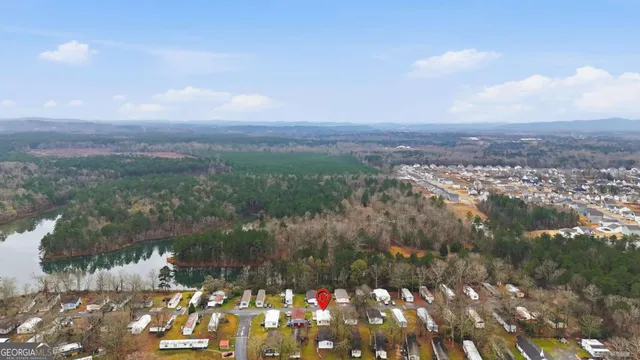 a kitchen with a sink a stove cabinets and stainless steel appliances
