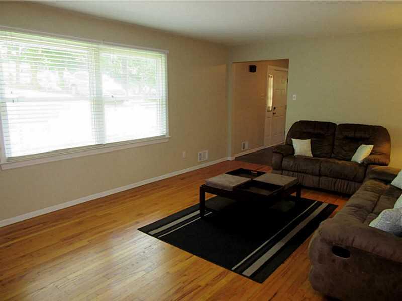 788 Scrubgrass Road Mt. Lebanon, PA 15243 - Photo 5 of 25 Living Room. Large front window, neutral paint, and hardwood floors in this large LR.