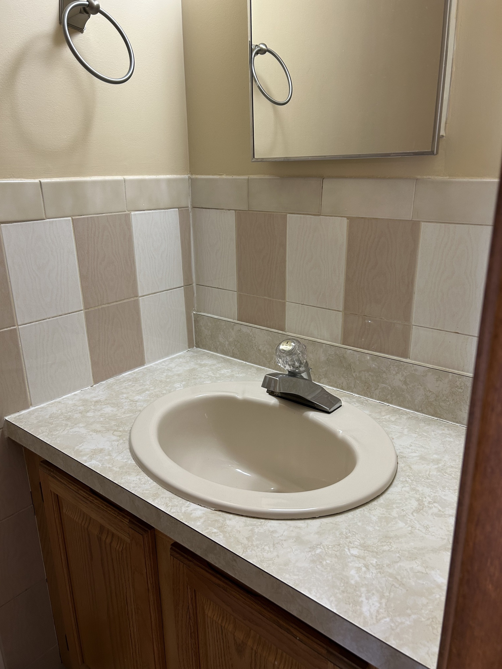 329 Scott Road, Unit B8 Waterbury, CT 06705 - Photo 13 of 16 a bathroom with a sink and a mirror