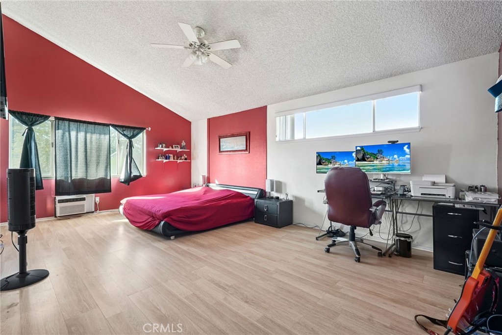 2130 Spice Street Lancaster, CA 93536 - Photo 21 of 45 a bedroom with a bed closet and a large window