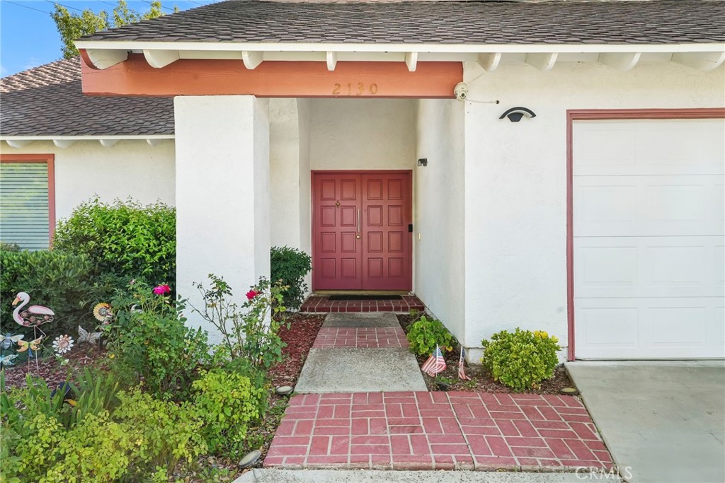2130 Spice Street Lancaster, CA 93536 - Photo 3 of 45 a view of a pathway door with an empty room