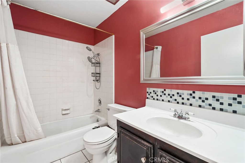2130 Spice Street Lancaster, CA 93536 - Photo 34 of 45 a bathroom with a sink a toilet and shower
