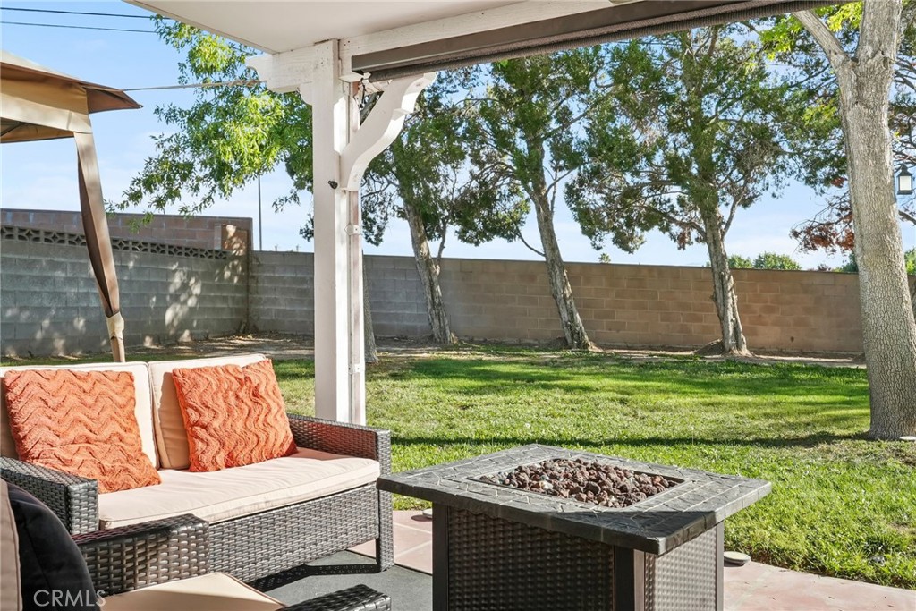 2130 Spice Street Lancaster, CA 93536 - Photo 40 of 45 a view of a backyard with couches plants and large tree