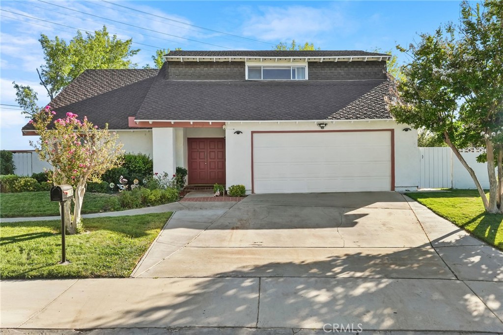 2130 Spice Street Lancaster, CA 93536 - Photo 42 of 45 a front view of a house with a yard and garage