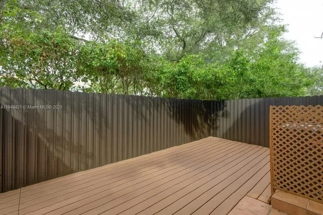 a balcony with trees in front of it