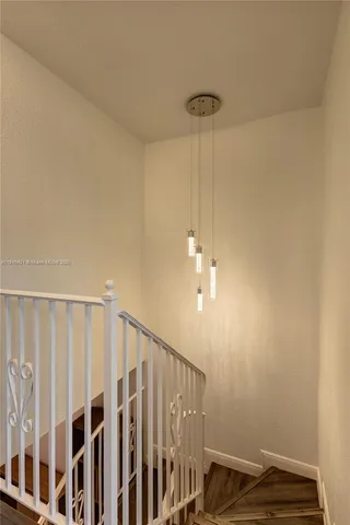 a view of a hallway with staircase