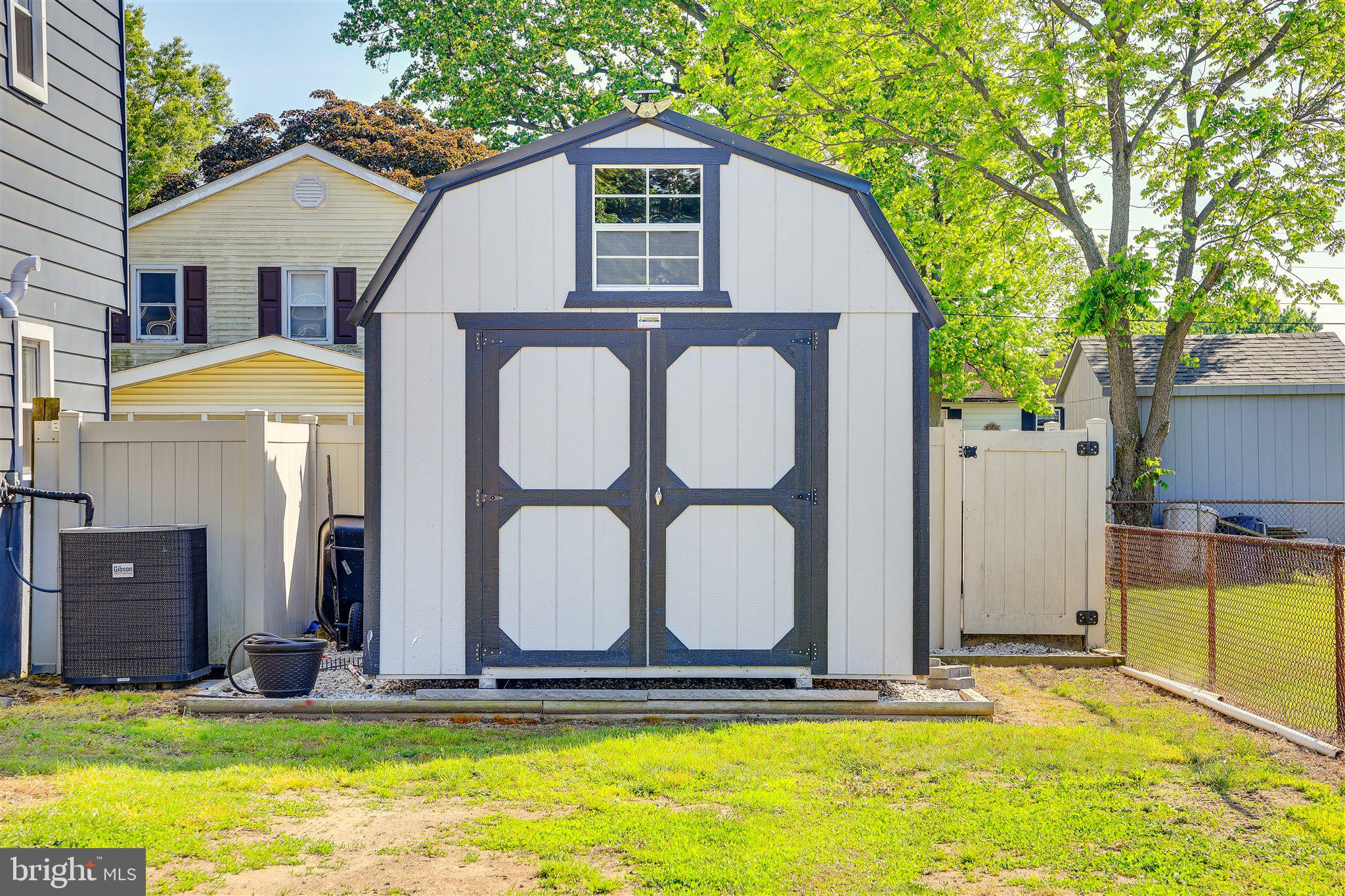 129 Michigan Road Pennsville, NJ 08070 - Photo 22 of 25 Charming backyard storage shed oasis.