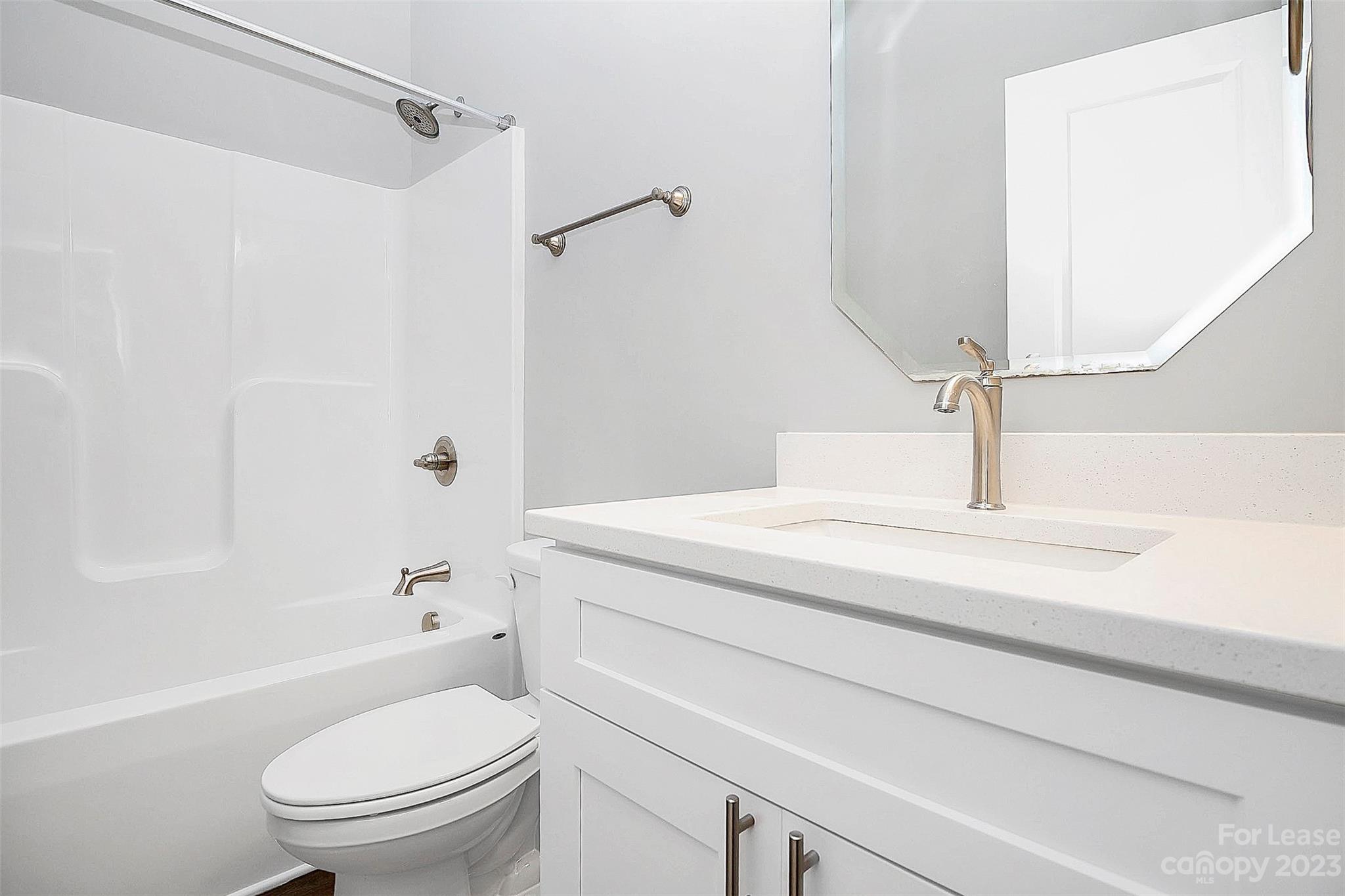 2301 Centergrove Road, Unit A Kannapolis, NC 28083 - Photo 11 of 12 a bathroom with a sink a toilet and shower
