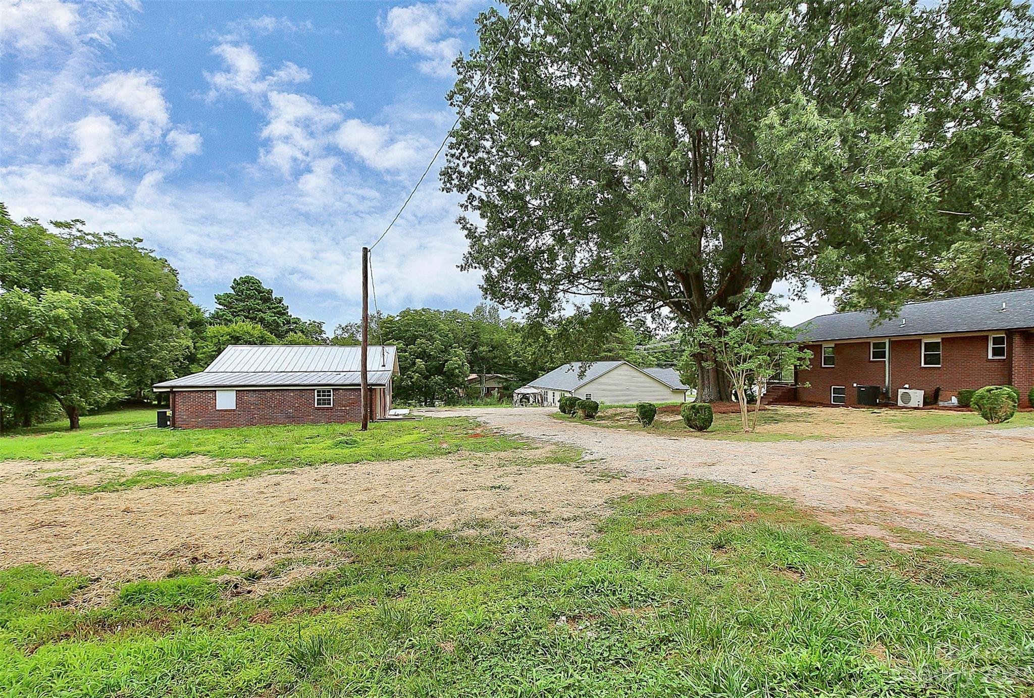 2301 Centergrove Road, Unit A Kannapolis, NC 28083 - Photo 12 of 12 a house with trees in the background
