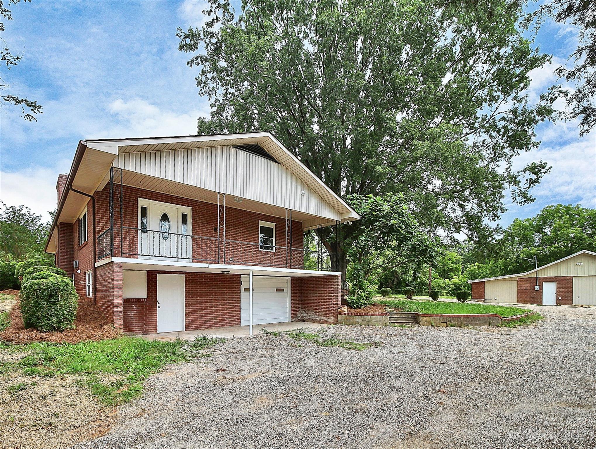 2301 Centergrove Road, Unit A Kannapolis, NC 28083 - Photo 2 of 12 a front view of a house with a yard and garage