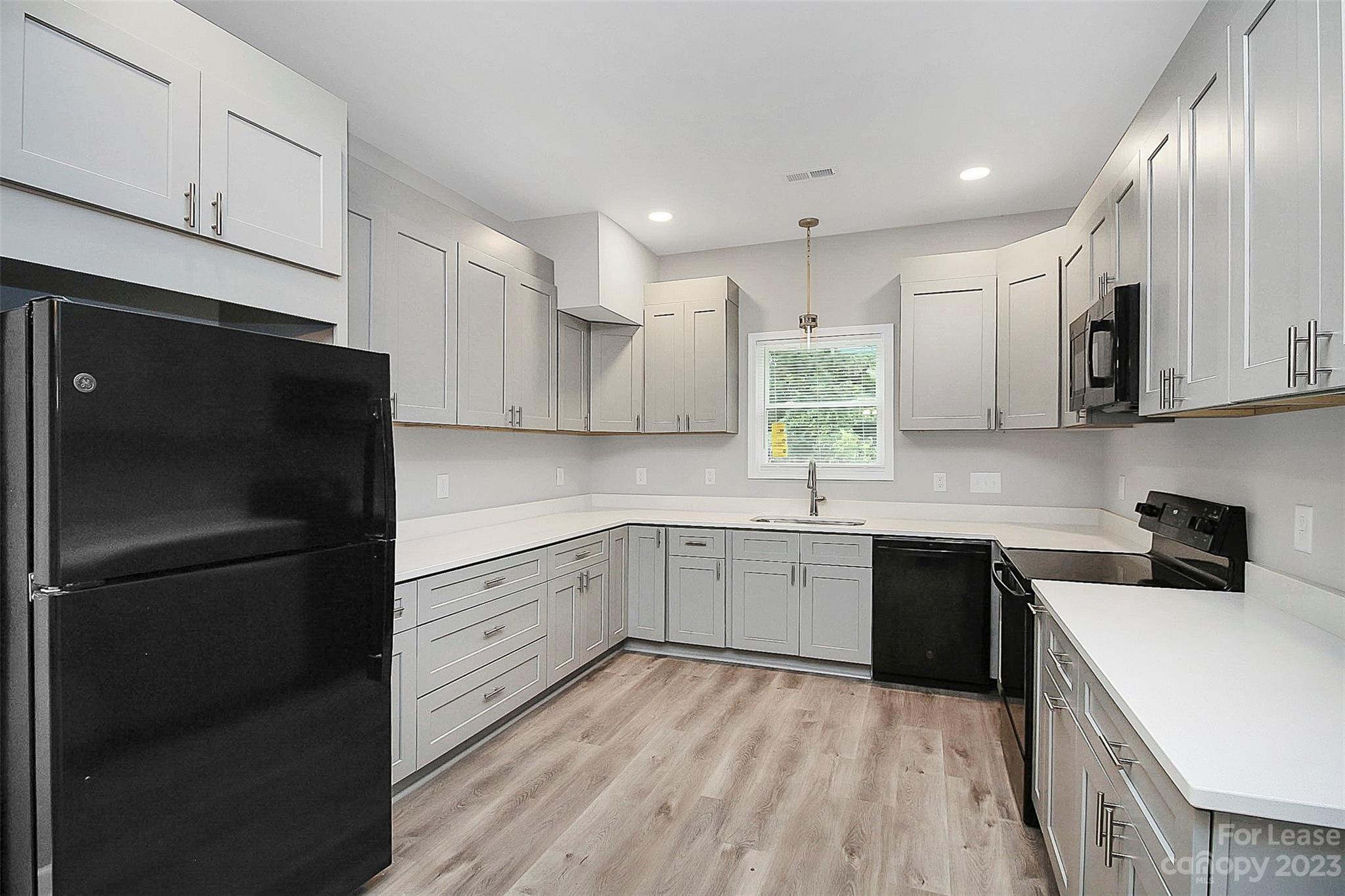 2301 Centergrove Road, Unit A Kannapolis, NC 28083 - Photo 5 of 12 a kitchen with a sink stainless steel appliances and cabinets