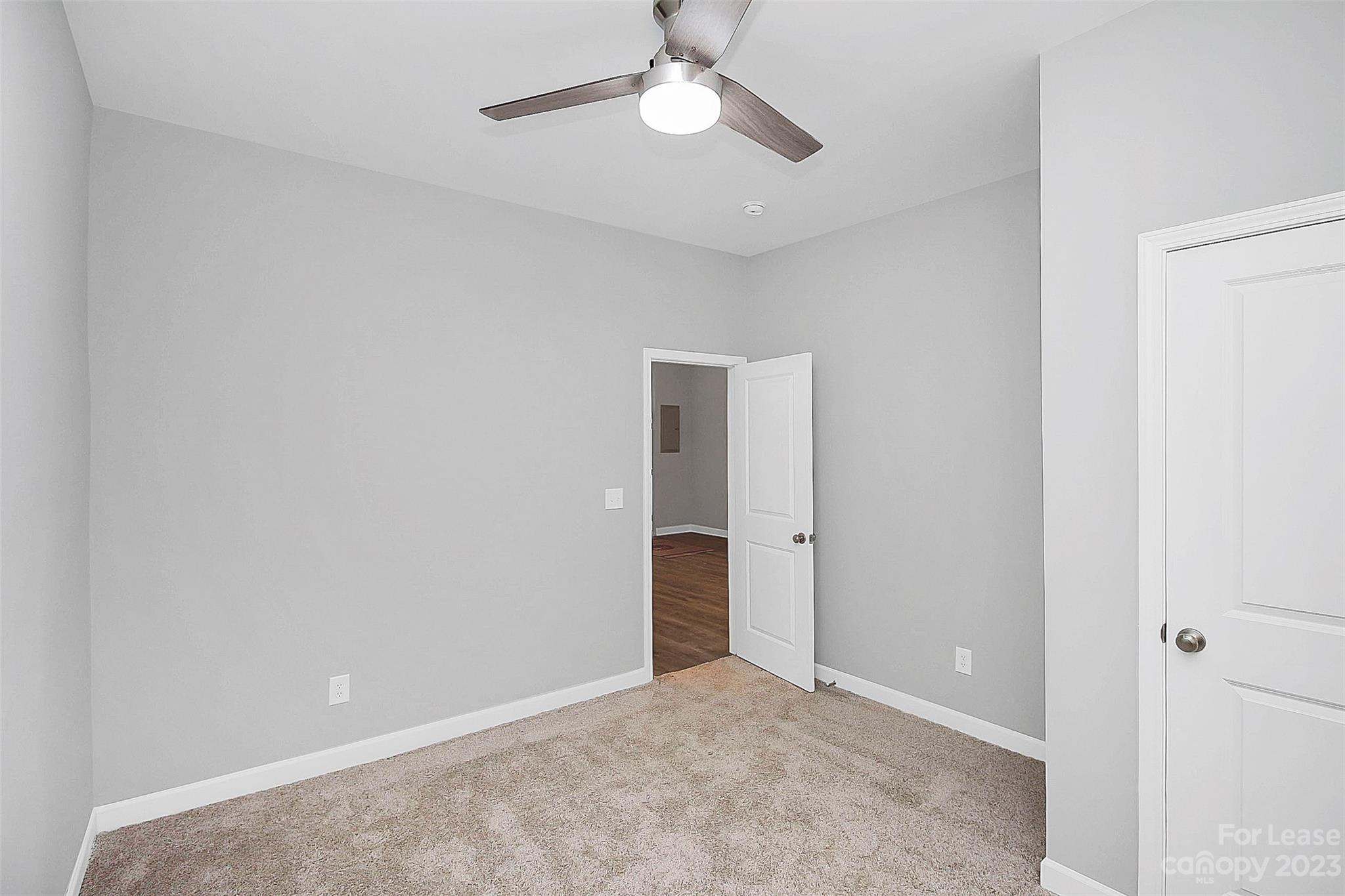 2301 Centergrove Road, Unit A Kannapolis, NC 28083 - Photo 10 of 12 an empty room with closet and a chandelier fan
