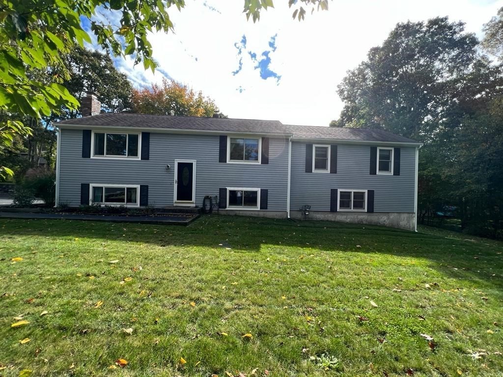 142 Clay Pond Road Bourne, MA 02532 - Photo 1 of 42 a front view of a house with garden