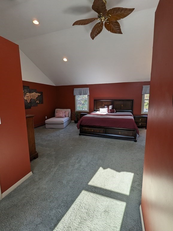 142 Clay Pond Road Bourne, MA 02532 - Photo 16 of 42 a living room with furniture and a rug
