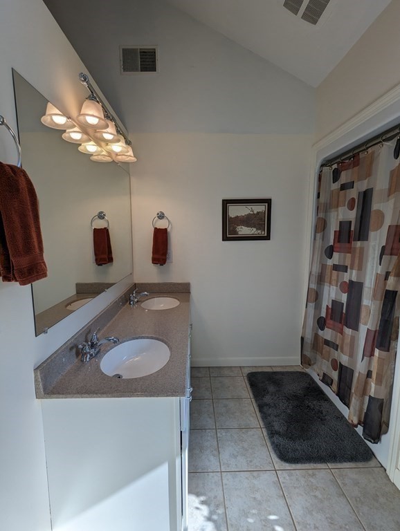 142 Clay Pond Road Bourne, MA 02532 - Photo 18 of 42 a bathroom with a sink and a mirror