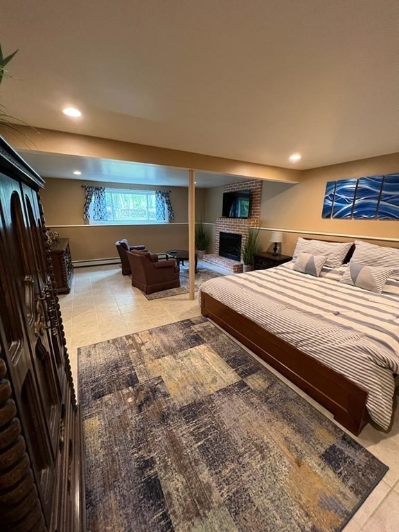 142 Clay Pond Road Bourne, MA 02532 - Photo 20 of 42 a bedroom with double bed and a walk in closet