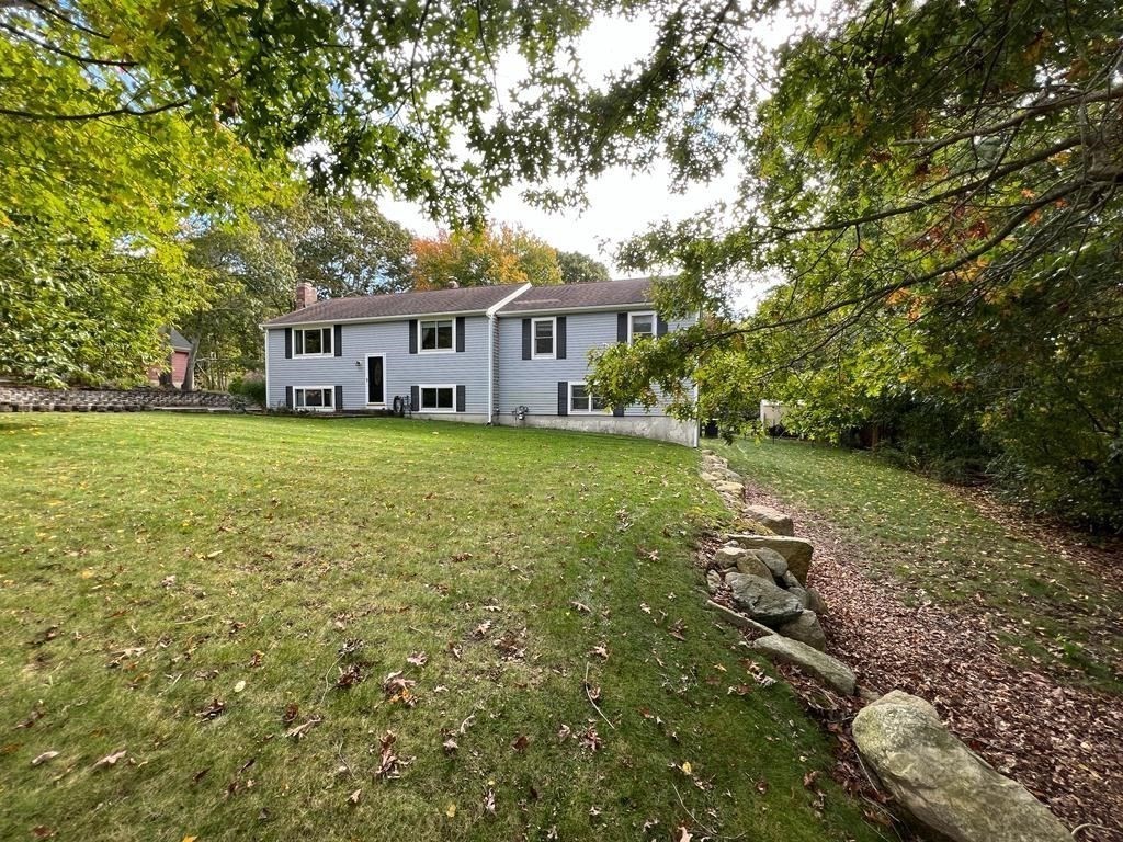 142 Clay Pond Road Bourne, MA 02532 - Photo 2 of 42 a view of a house with a yard
