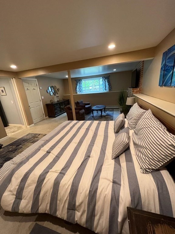142 Clay Pond Road Bourne, MA 02532 - Photo 23 of 42 a bed room with two beds and a night stand