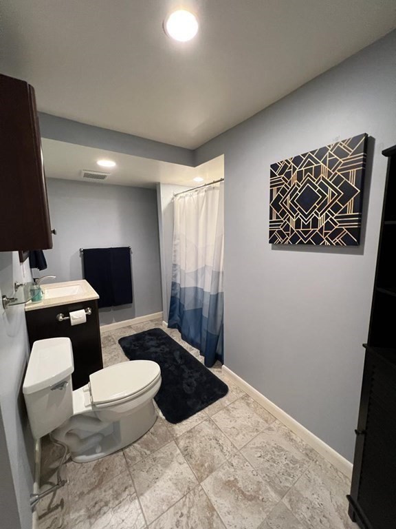 142 Clay Pond Road Bourne, MA 02532 - Photo 27 of 42 a bathroom with a toilet a sink and mirror