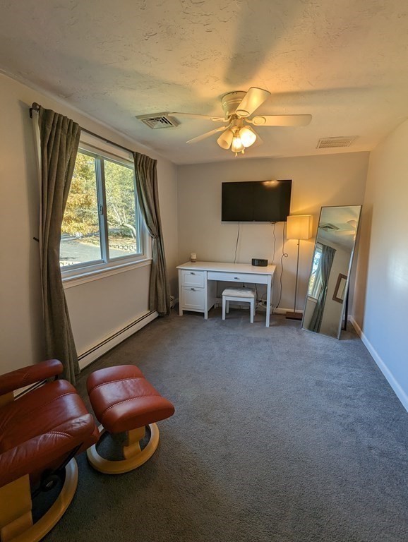 142 Clay Pond Road Bourne, MA 02532 - Photo 33 of 42 a room with furniture and a flat screen tv