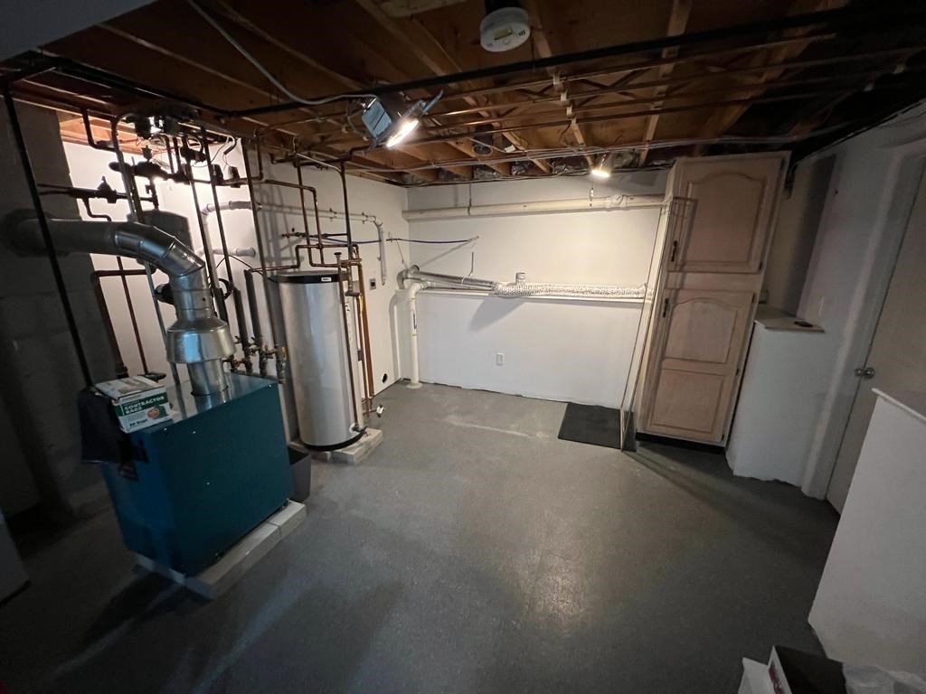 142 Clay Pond Road Bourne, MA 02532 - Photo 40 of 42 a view of a garage with wooden furniture