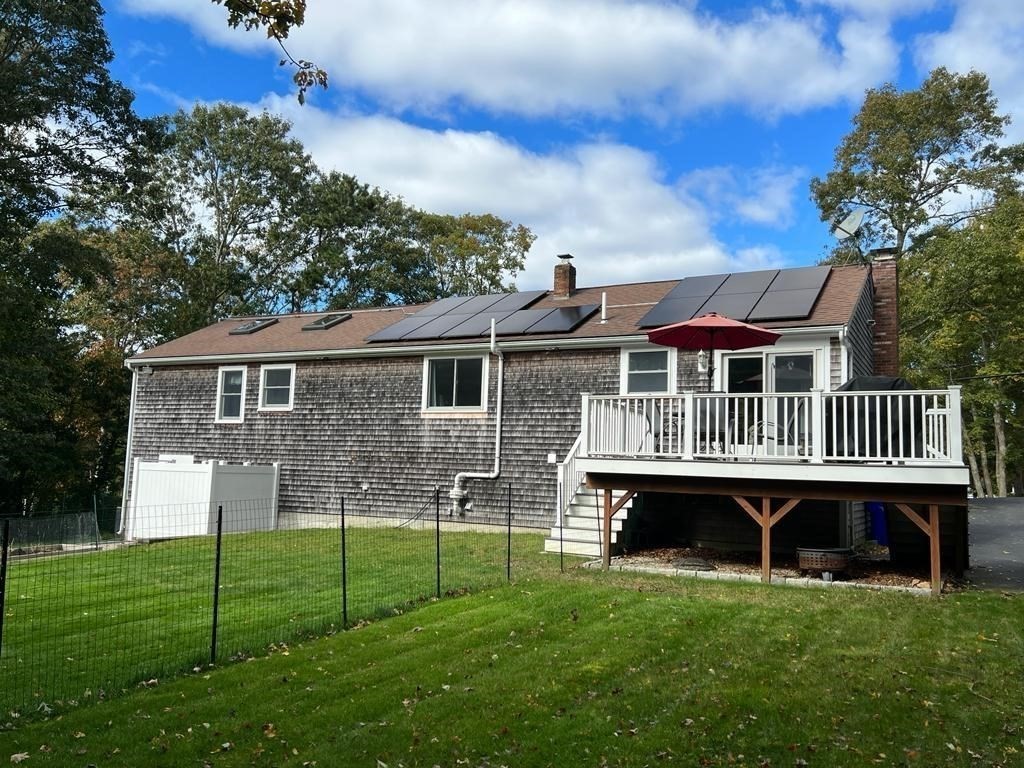 142 Clay Pond Road Bourne, MA 02532 - Photo 4 of 42 front view of a house with a yard