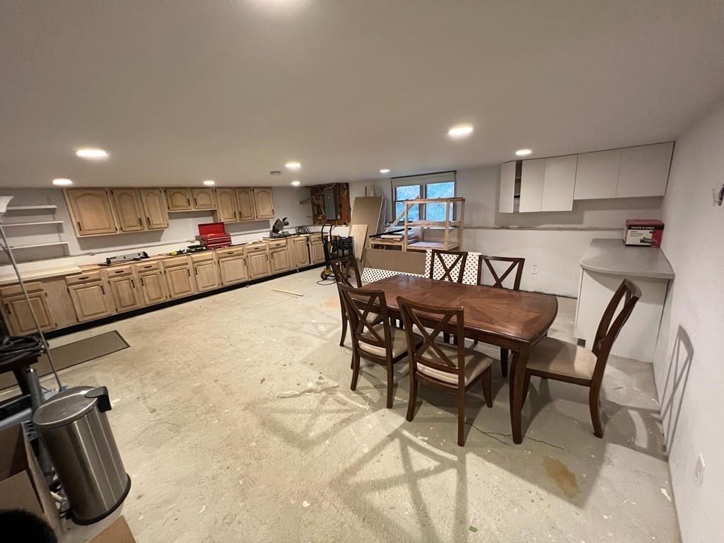 142 Clay Pond Road Bourne, MA 02532 - Photo 41 of 42 a kitchen with kitchen island granite countertop lots of counter top space and furniture