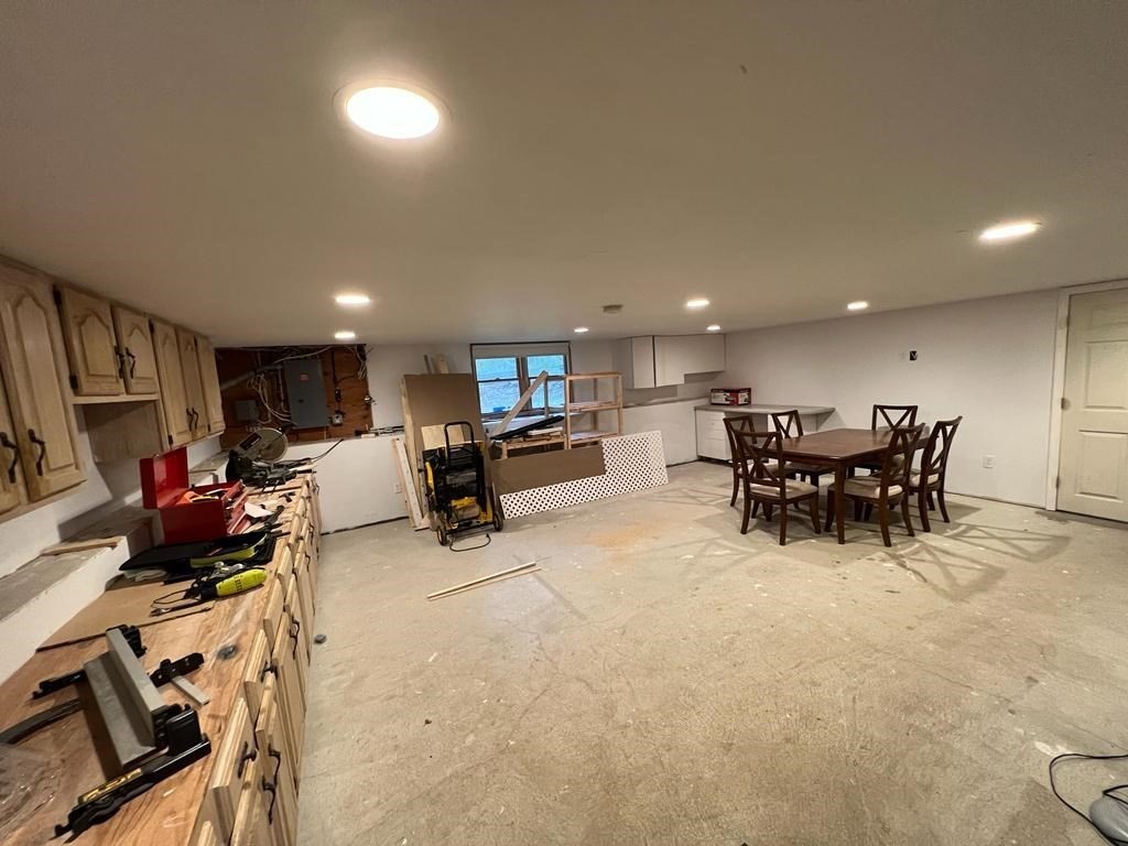 142 Clay Pond Road Bourne, MA 02532 - Photo 42 of 42 a living room with furniture and a flat screen tv