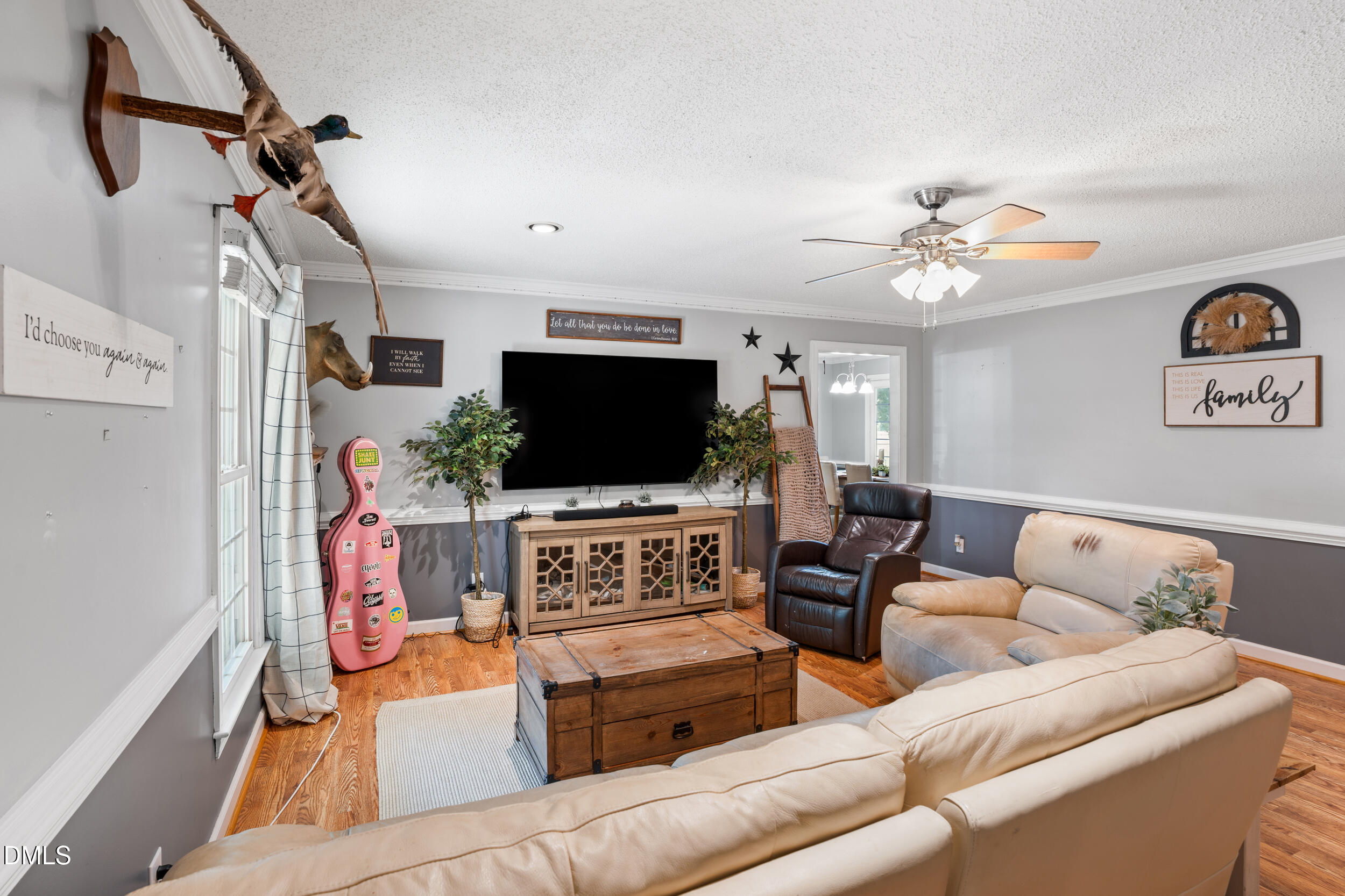 311 Bridgers Road Kenly, NC 27542 - Photo 16 of 46 a living room with furniture and a flat screen tv