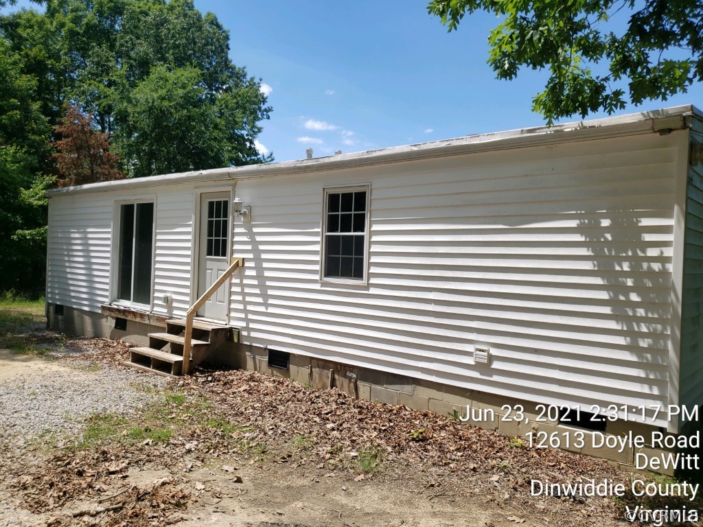 12613 Doyle Road Dewitt, VA 23840 - Photo 4 of 22 a backyard of a house