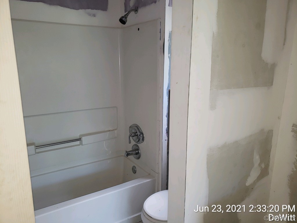12613 Doyle Road Dewitt, VA 23840 - Photo 7 of 22 a bathroom with a shower and toilet
