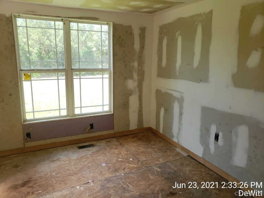 12613 Doyle Road Dewitt, VA 23840 - Photo 8 of 22 a view of an empty room with a window