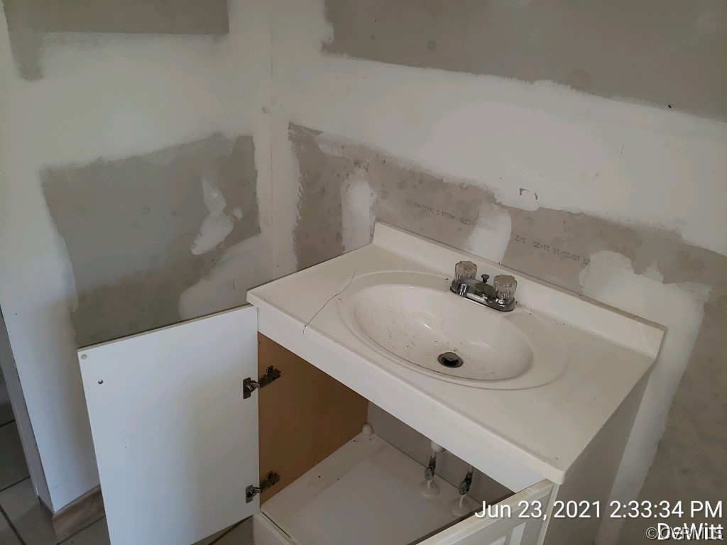 12613 Doyle Road Dewitt, VA 23840 - Photo 10 of 22 a bathroom with a sink and mirror
