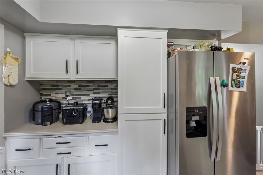 8310 Broadview Road Broadview Heights, OH 44147 - Photo 11 of 32 White shaker-style cabinetry with black hardware