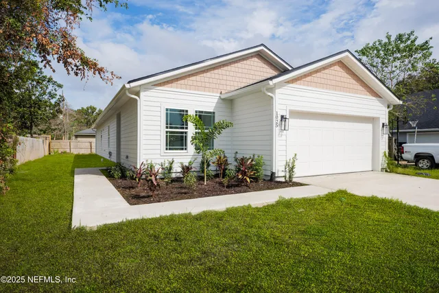 a front view of house with yard and outdoor seating