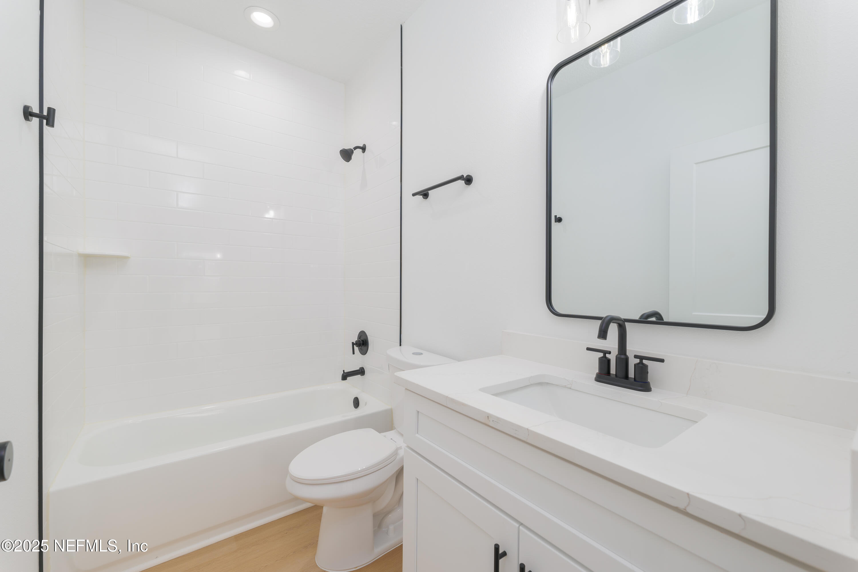 7596 Silver Sands Road Keystone Heights, FL 32656 - Photo 21 of 26 a bathroom with a sink a toilet and shower