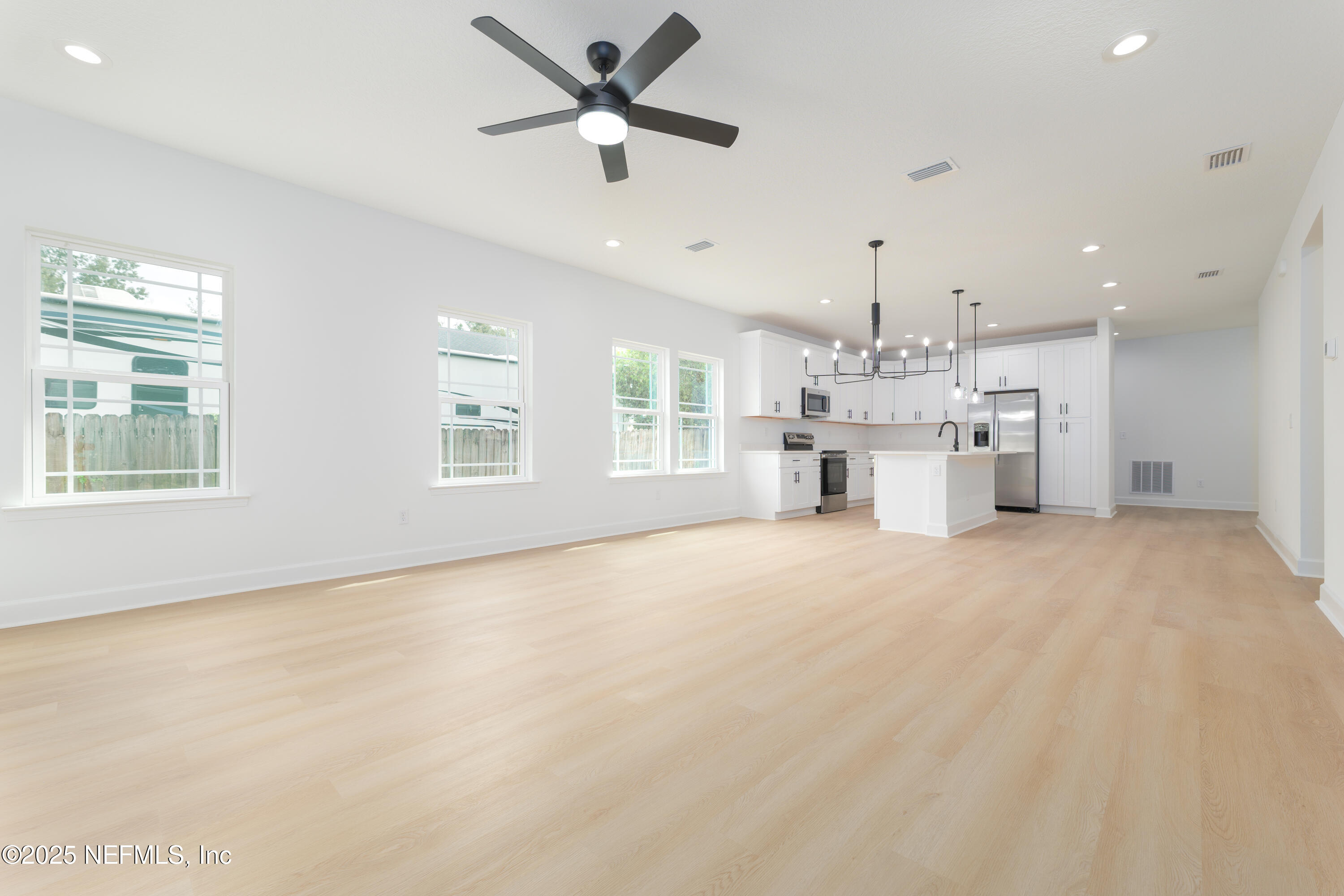 7596 Silver Sands Road Keystone Heights, FL 32656 - Photo 9 of 26 a view of a kitchen with a sink and a window