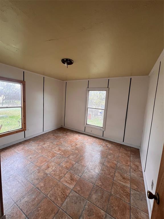 206 Third Street Hillsboro, TX 76645 - Photo 11 of 14 a view of an empty room with a window