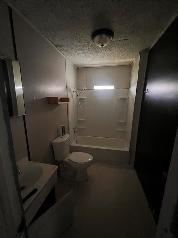 206 Third Street Hillsboro, TX 76645 - Photo 13 of 14 a bathroom with a sink a toilet and shower