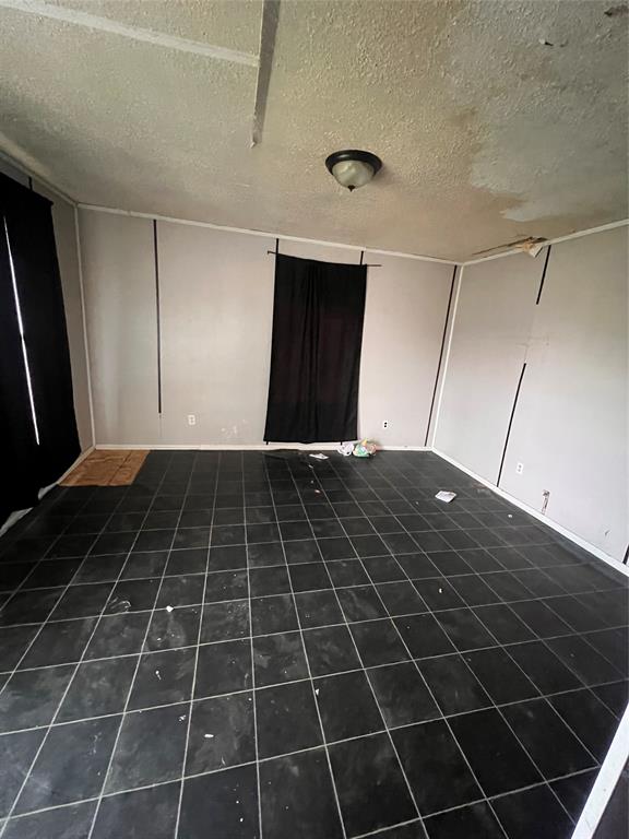 206 Third Street Hillsboro, TX 76645 - Photo 6 of 14 a view of a black and white wall